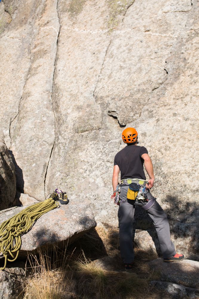 A rock climber is staring at the mountain