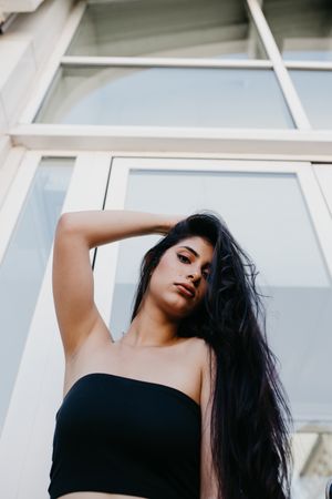 Woman posing near window