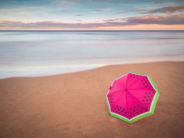 Umbrella on beach near sea
