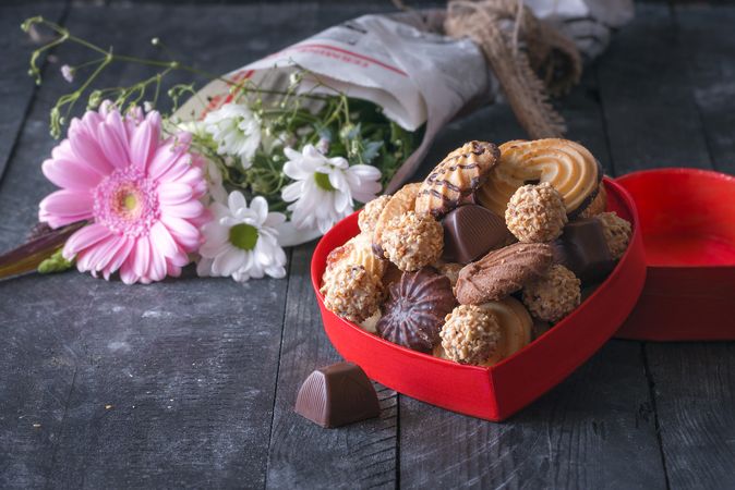 Heart shaped box with sweets and flowers