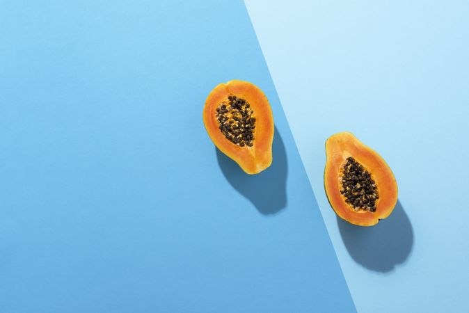 Fresh papaya fruit cut in half
