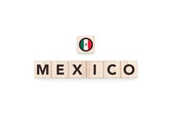 Wooden blocks bearing the name and flag of Mexico.