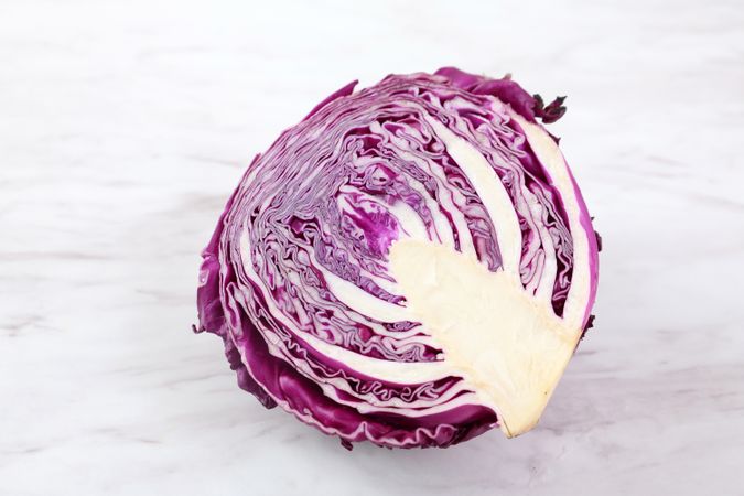 Half Siced Red Purple Cabbage on Marble Table.