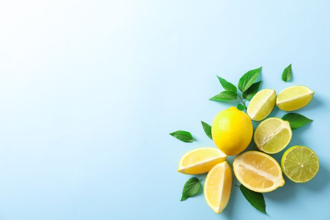 Flat lay composition with citrus on color background, space for text