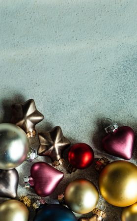 Colorful Christmas baubles on table