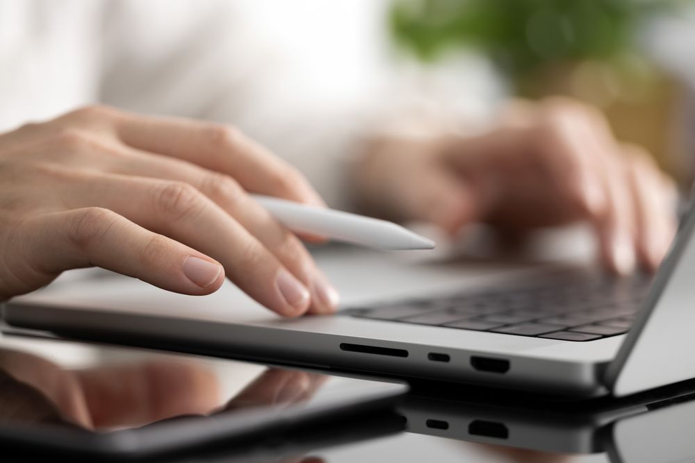 Man Working On Laptop Close-Up
