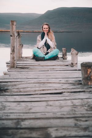 Woman on pier near wonderful lake