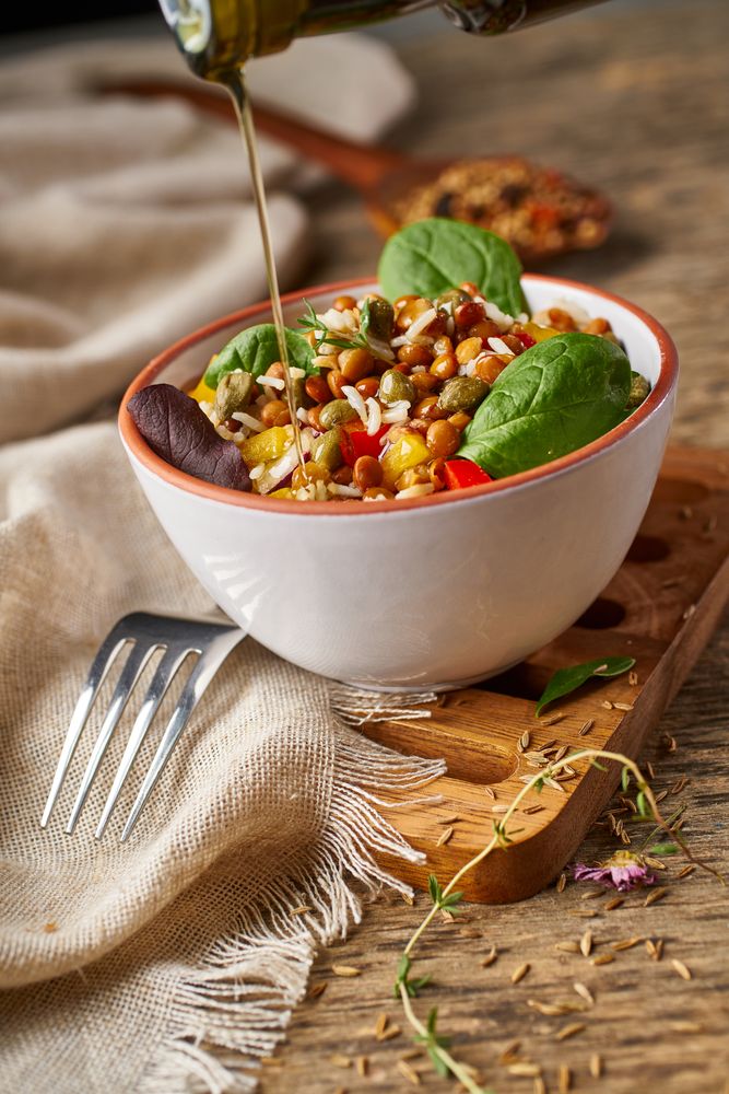 Bright vegetables with lentils and spinach in bowl