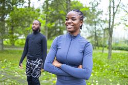 Black woman and her friend during their morning fitness session.
