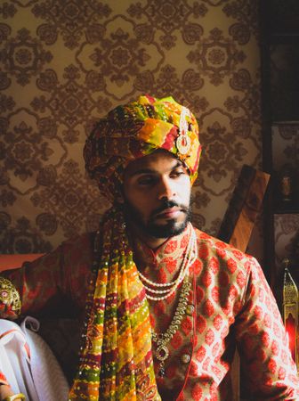 Portrait of Indian man wearing turban sitting indoor