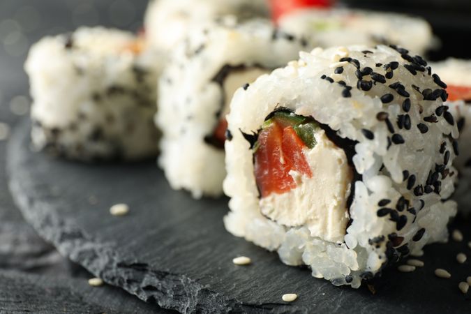 Tray with delicious sushi rolls, close up. Japanese food