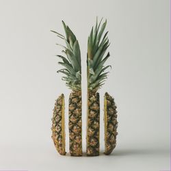Split pineapple on light background