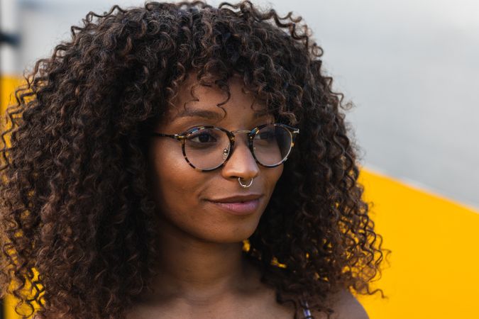 Trendy Black female against bright wall