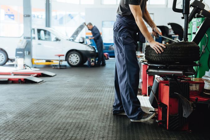 Car repair shop with mechanics working