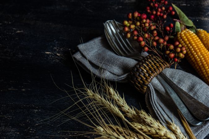 Cutlery with fall decorations of wheat, berries and corn