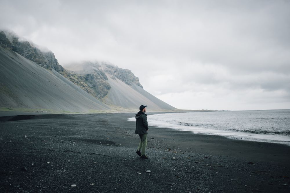 Man looking out on the coast on a winter’s day