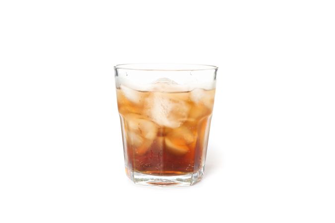 Glass of cold cola isolated on blank background