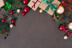 Christmas gifts and decorations on dark background with copy space