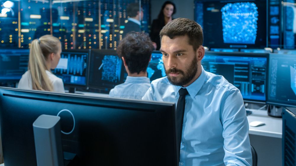 Neural Network and Machine Learning Engineer Programming at His Workstation.