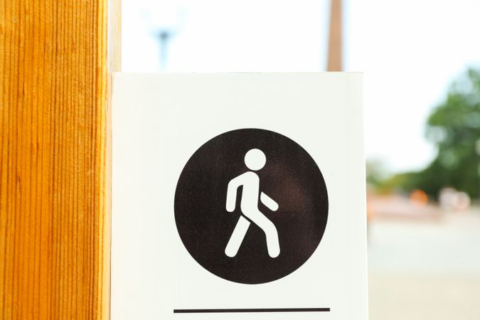 Sign for pedestrians in park, close up