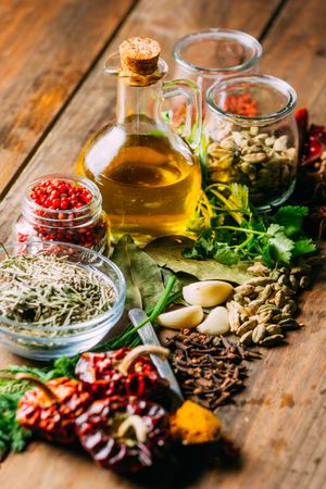 Spices and oil on table