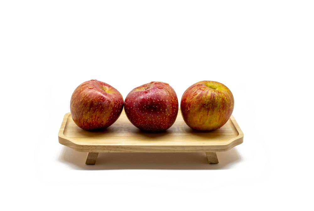 apples on a wooden tray