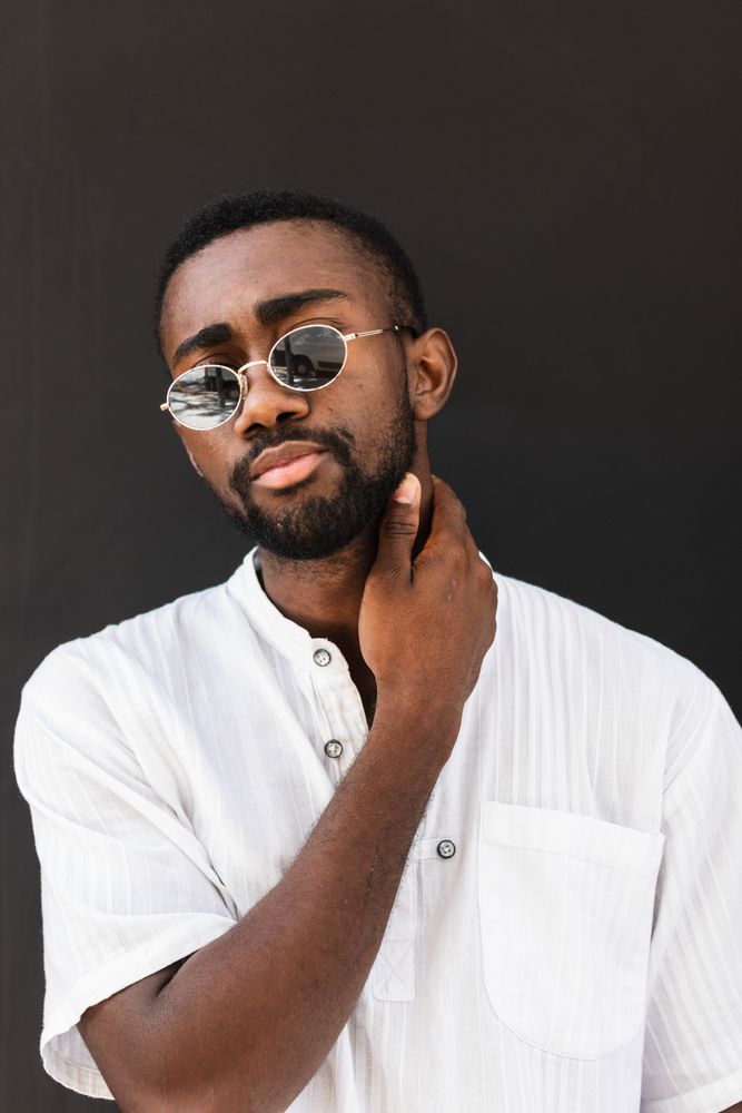 Black man in trendy clothes in city