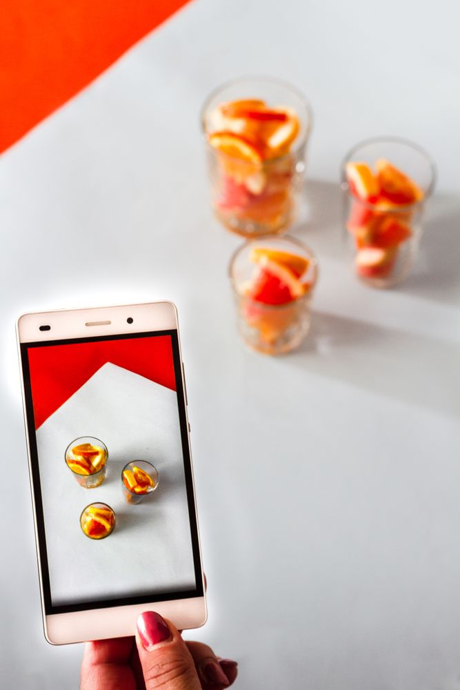 Photo of sliced citrus fruits on mobile phone