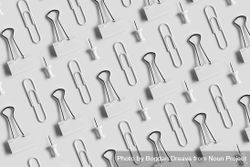 Binder clips, paper clips and tacks on light background 5z9Xm0