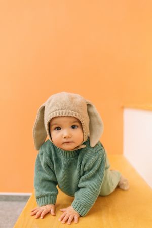 Cute baby sitting on stairs