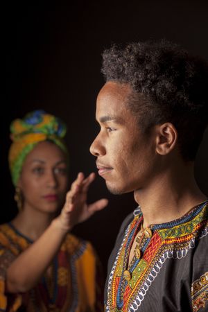 Woman pulling hand to face of man