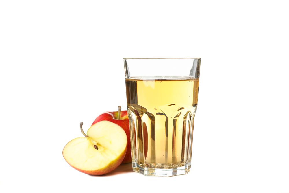 Glass of apple cider isolated on blank background