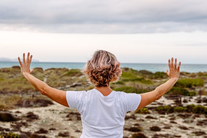 Adult woman practicing martial arts in nature