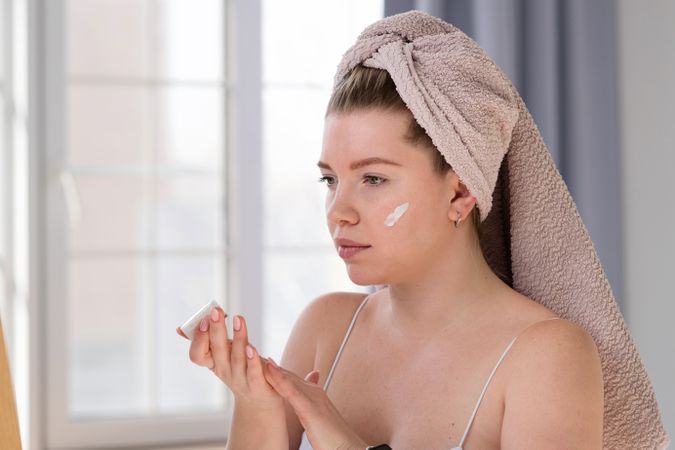 Applying facial cream