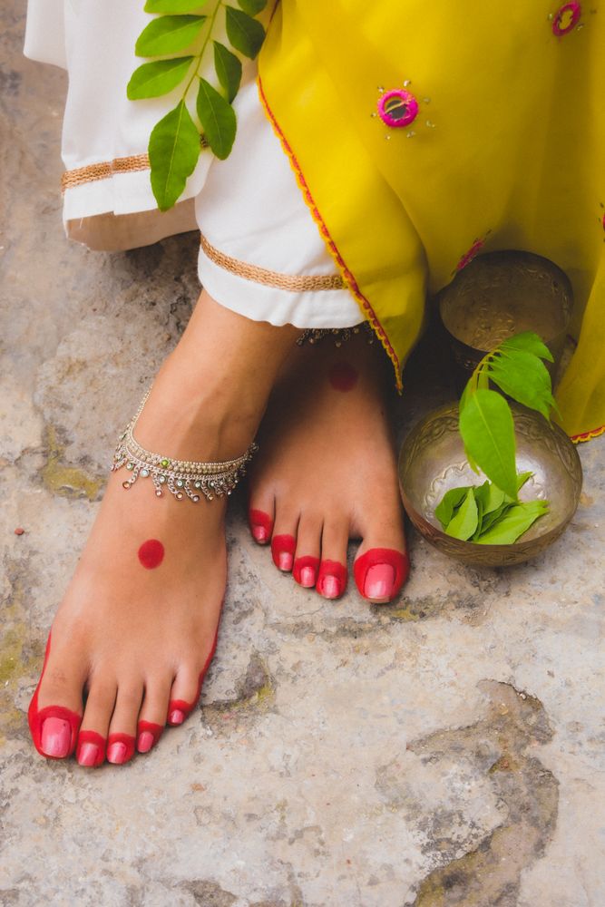 Woman's feet painted with henna