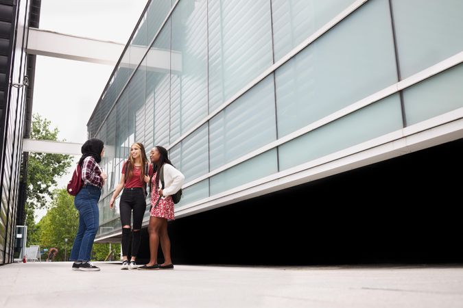 Female friends having a discussion on campus