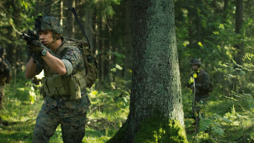Fully Equipped Soldier in Camouflage on a Reconnaissance Military Mission