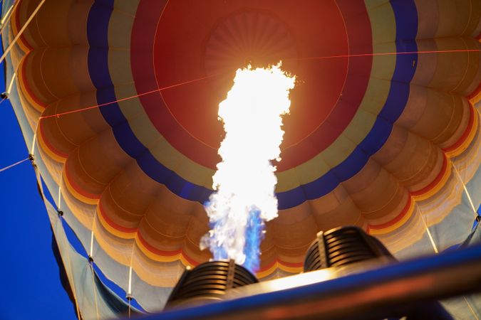 Close up of flame heating hot air balloon before flight