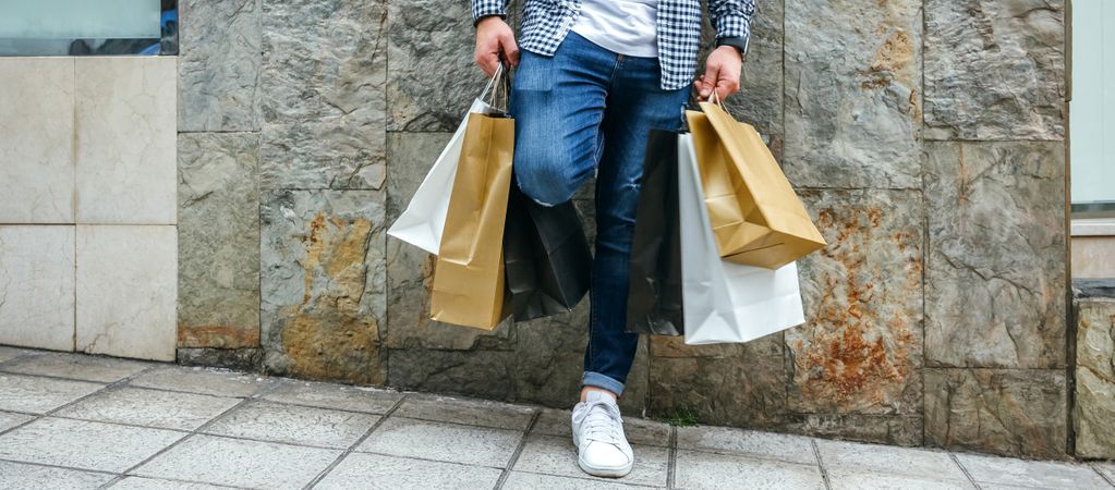 Young man with shopping bags