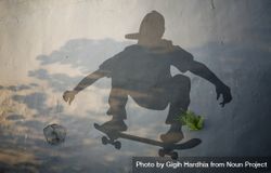Shadow of person on skateboard on wall 0veGBb