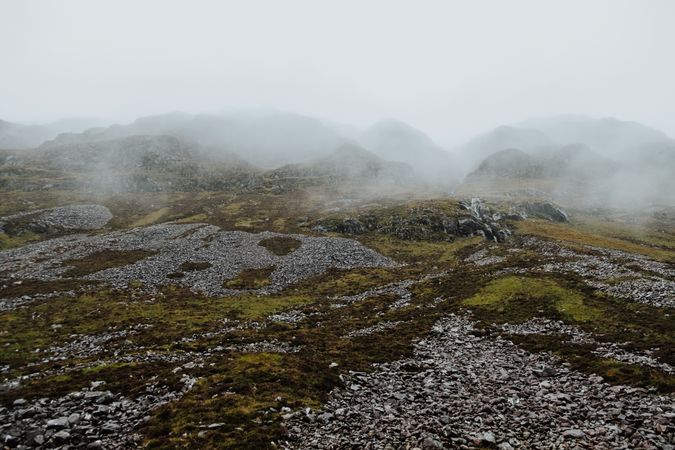 Rocky hills covered by mist in Scotland