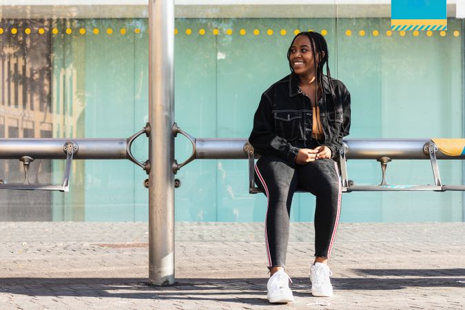 Happy female on bus stop