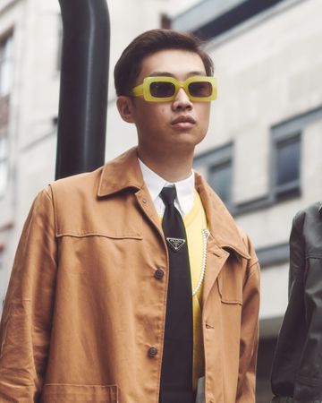London, England, United Kingdom - September 18 2021: Asian man at fashion week in bold sunglasses