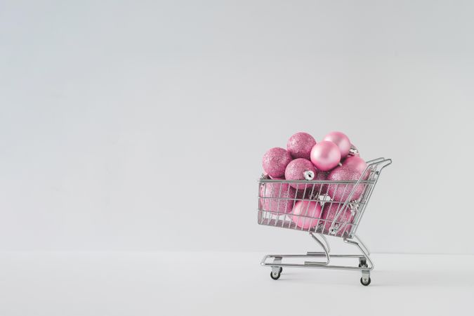 Shopping cart with pink Christmas decoration
