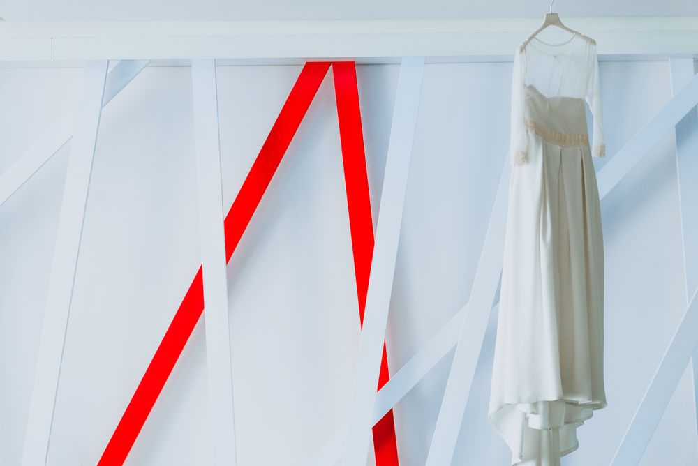 Wedding dress hanging on hanger