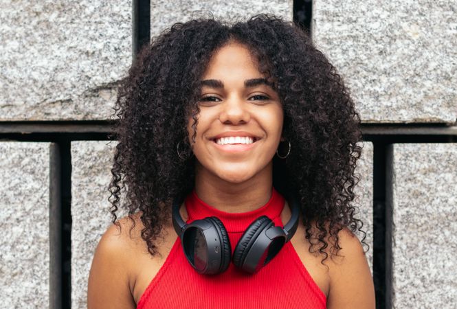 Portrait of a woman with afro hair enjoying in the city