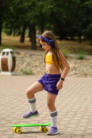 Girl playing on Skateboard