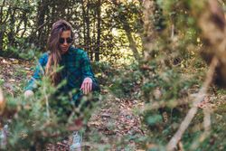Stylish female teenager in casual outfit at autumn forest