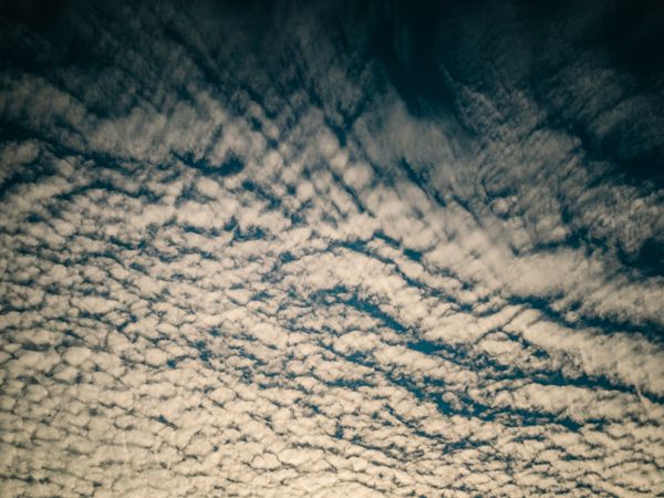 Picturesque cloudy sky at sundown