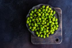 Plate of green Georgian tkemali fruit
